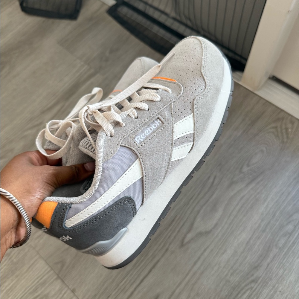 Brand-new women’s steel-toe sneakers, size 8.